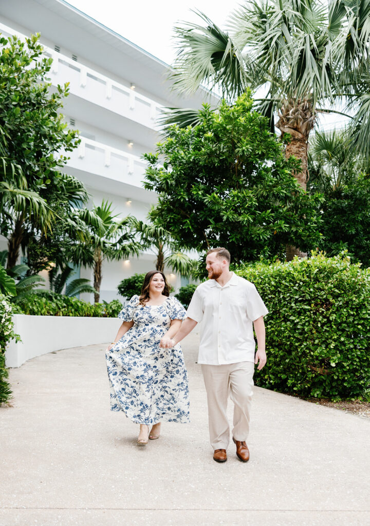 Claire and Reece stroll through the greenery-filled pathways of Bakers Cay Resort, making the most of their engagement shoot with a top Key Largo photographer.