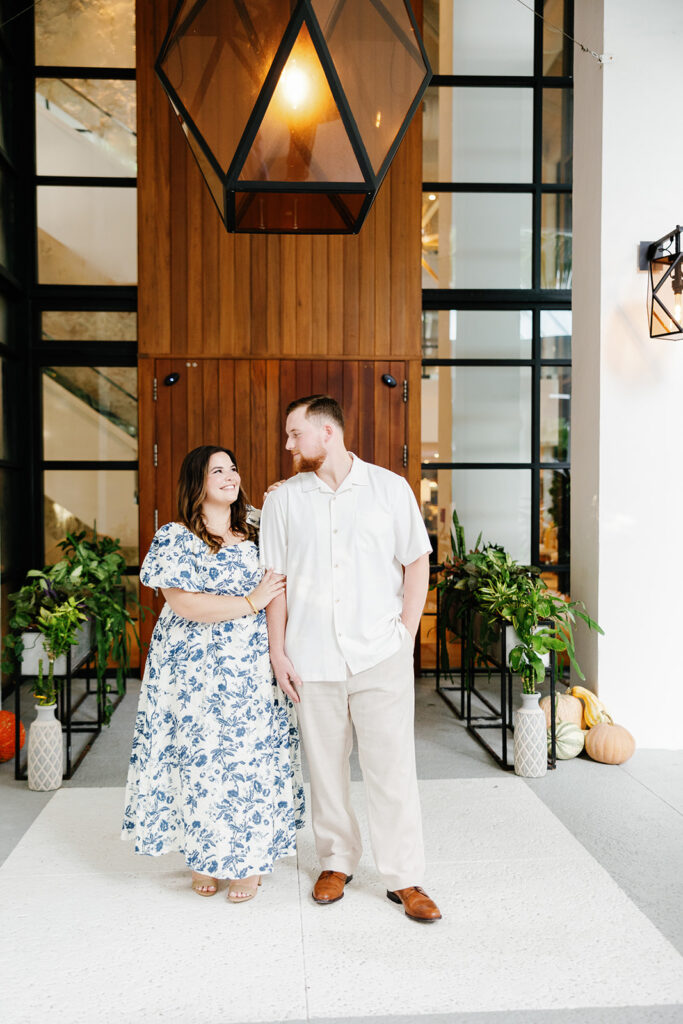 A candid moment of Claire and Reece sharing a loving glance under the warm glow of the resort’s signature lighting, photographed by Claudia Amalia.