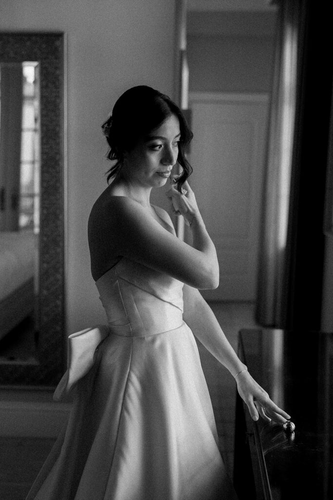 Bride Jeannie sprays perfume while getting ready for her wedding at the Biltmore Hotel Coral Gables.