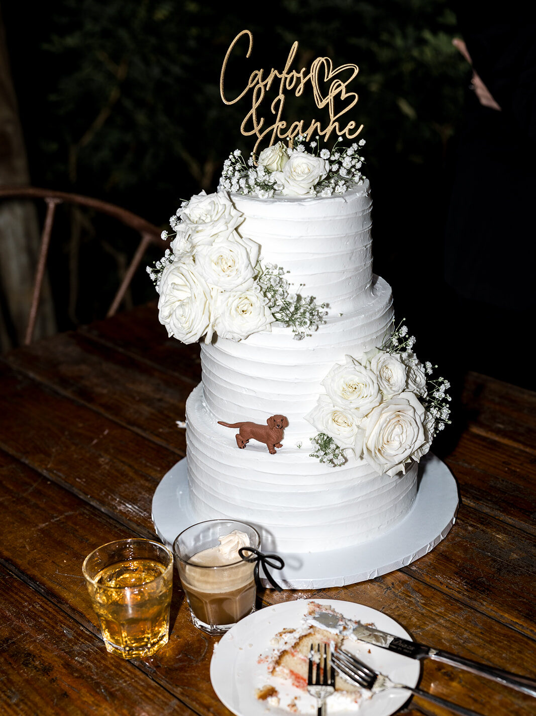 Elegant white wedding cake with custom Carlos & Jeannie topper at Biltmore Hotel Coral Gables.