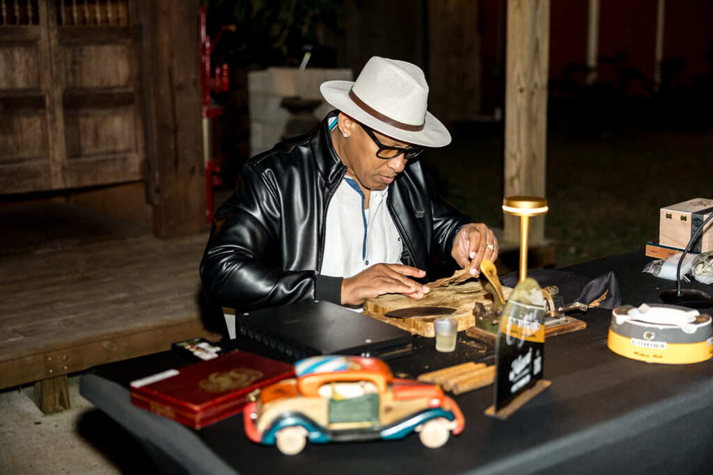 A professional cigar roller at Jeannie and Carlos’ wedding reception at Biltmore Hotel Coral Gables.