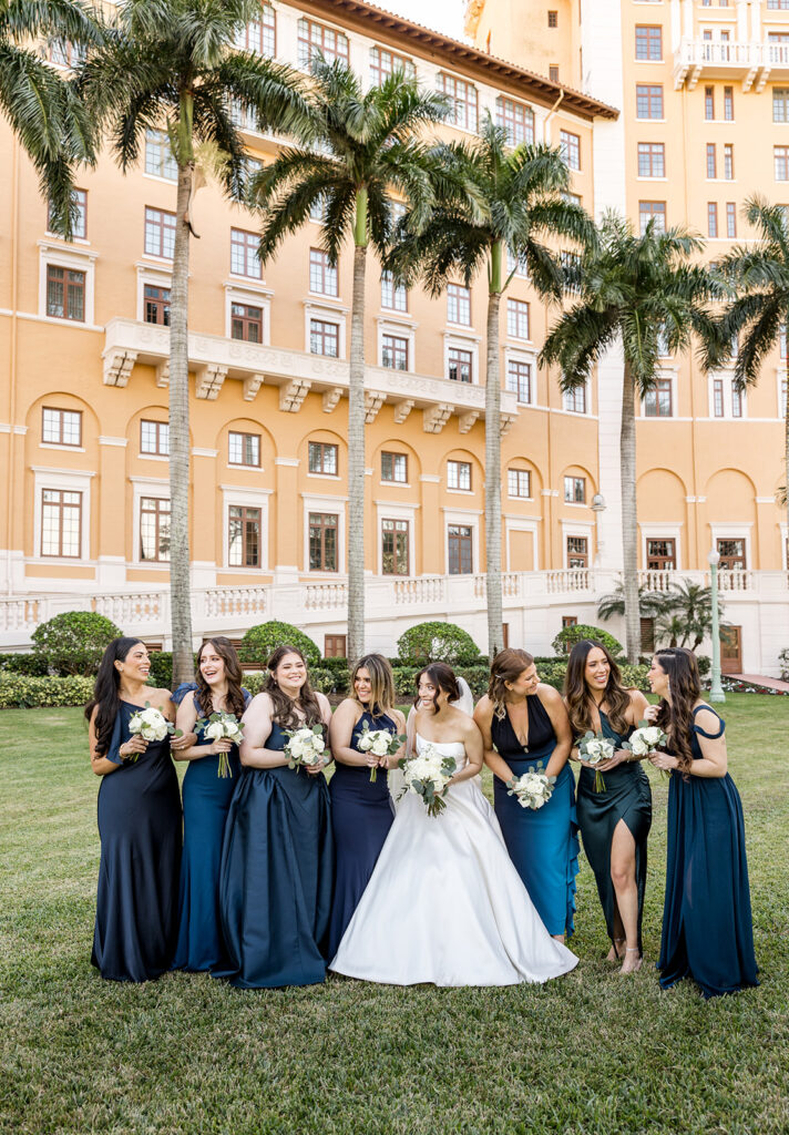 Bride laughing with her bridesmaids at Biltmore Hotel Coral Gables.