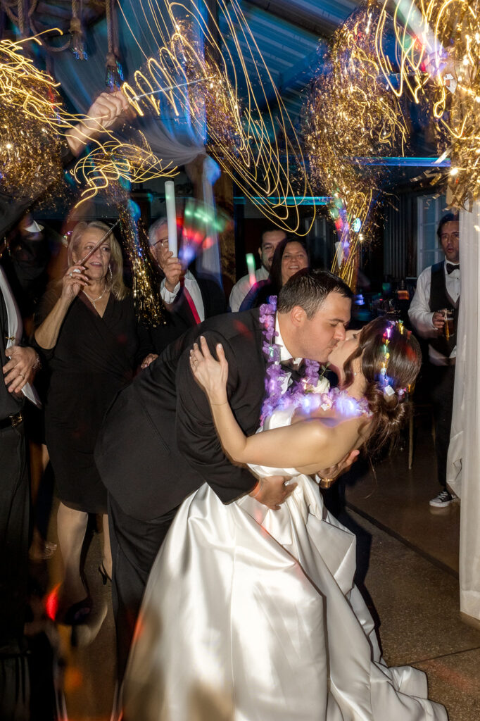 Jeannie and Carlos share a breathtaking kiss during their sparkler exit at Biltmore Hotel Coral Gables.