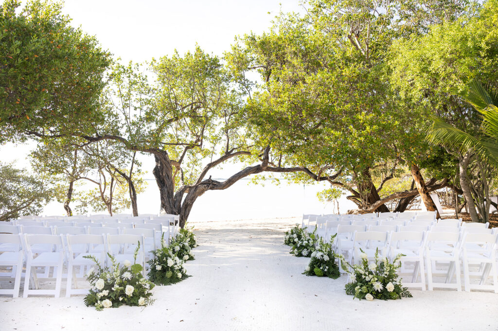 Claire & Reece's ceremony setup at Baker's Cay resort. Captured by Claudia Amalia Photography.