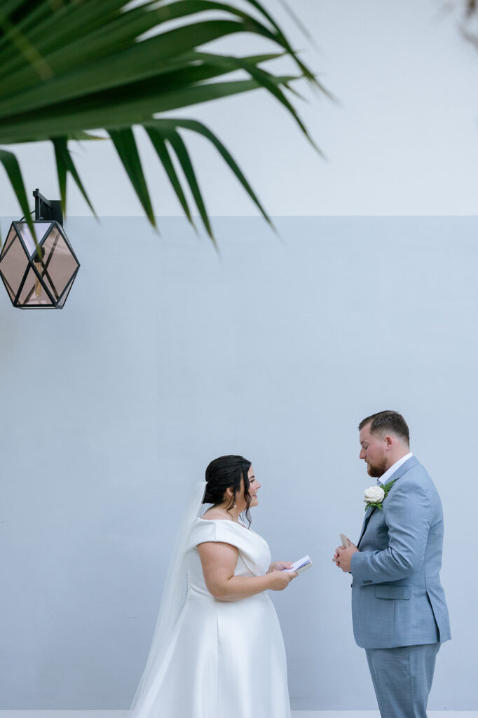 Reece and Claire share their first look and exchange their private vows. Captured by wedding photographer, Claudia Amalia.