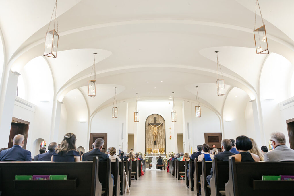 Bride and groom sitting during a traditional church ceremony for a modern city wedding.