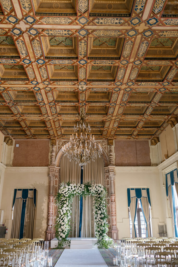 Luxurious ceiling and floral arch design at a premium Miami city weddings location.