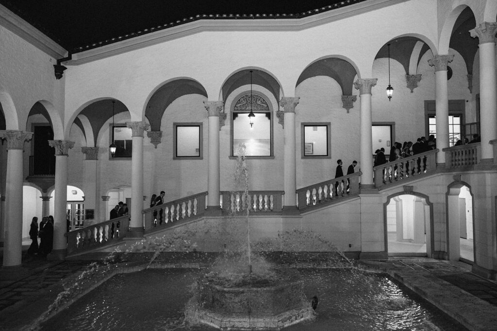 Black and white photo of a stunning courtyard fountain and archway for a grand Miami city weddings venue.