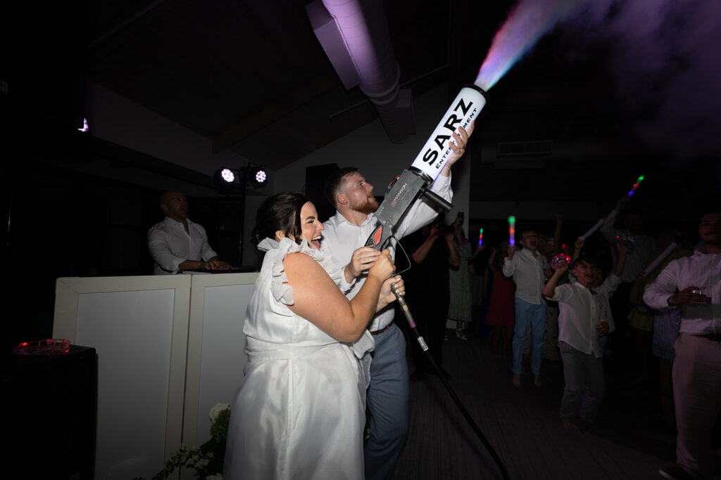 Bride using a party cannon during a high-energy Key Largo weddings reception party.