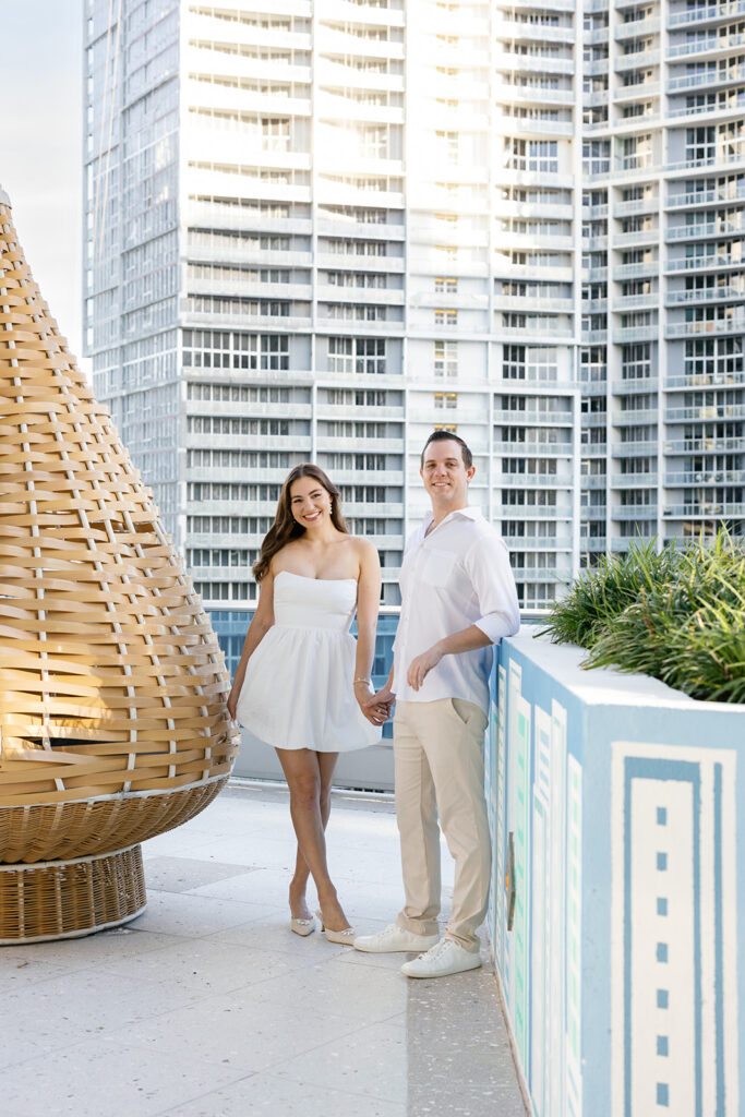 Engaged couple portraits on a rooftop balcony for a Miami city weddings session.