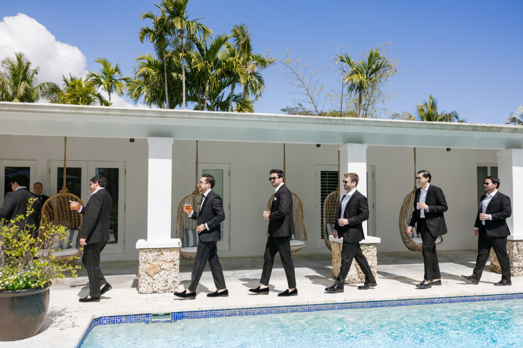 Groom with his groomsmen during wedding morning 