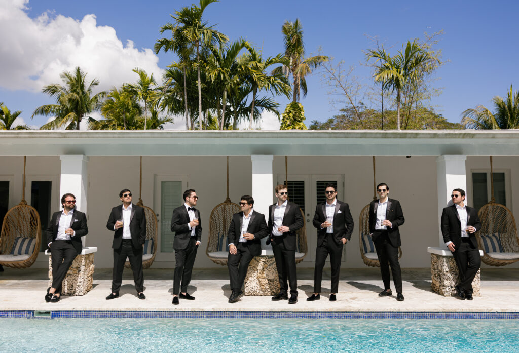 Groom with his groomsmen during wedding morning getting ready photos
